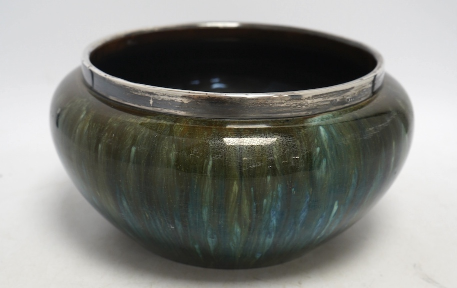 A Christopher Dresser for Linthorpe pottery bowl, silver rimmed, stamped to the base, 24cm in diameter. Condition - good